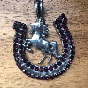 Huge silvertone horseshoe shaped pendant w/ purple stones figure of horse inside